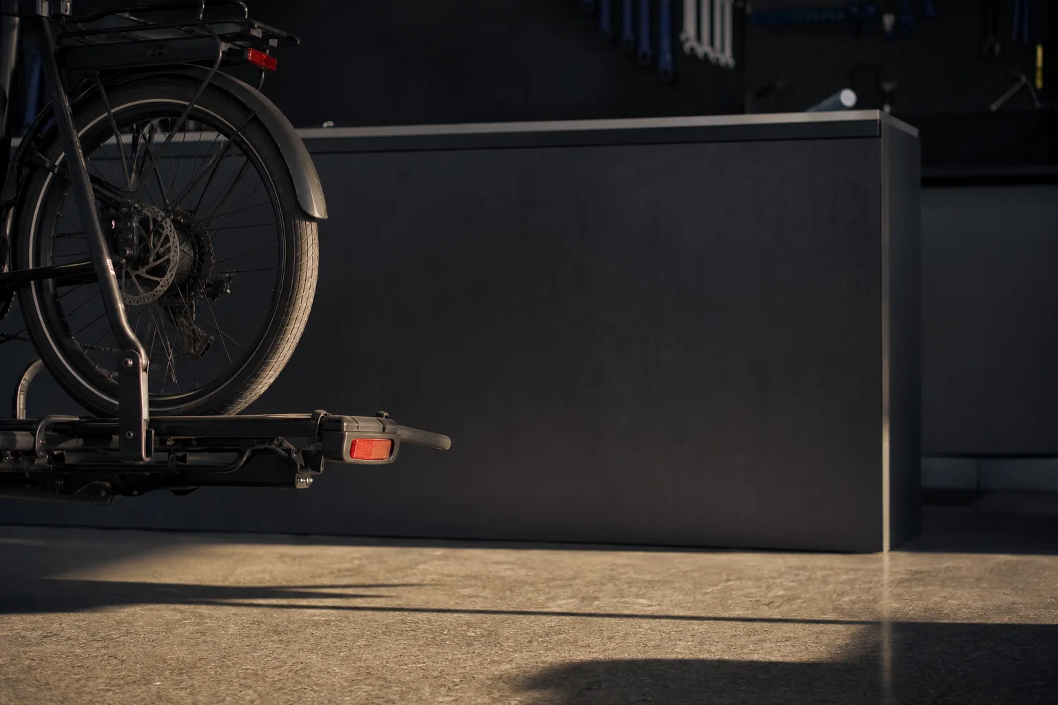 Fifty-five pounds on a hitch rack, on a flat tire, at the service counter